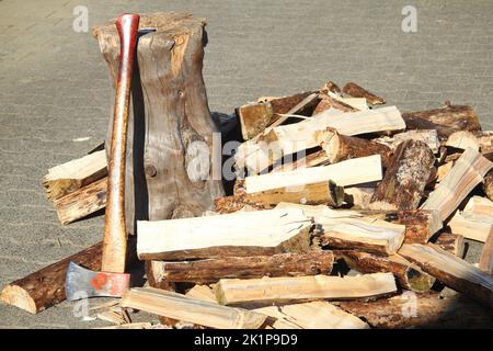 some Split firewood with ax and block Stock Photo