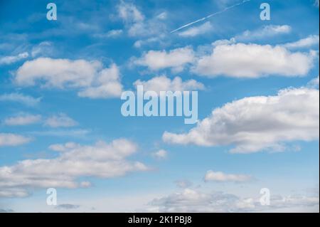 white cloud on blue sky. some white whispy clouds and blue sky cloudscape. Beautiful blue sky and clouds natural background. Blue sky and white fluffy Stock Photo