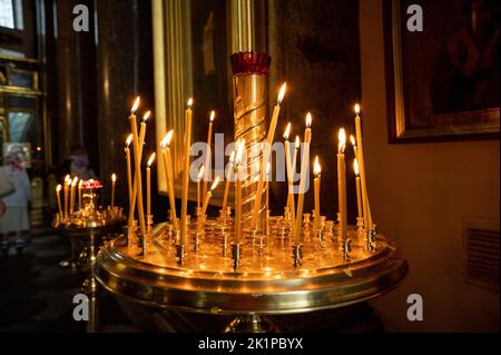 Candles in christian church ortodox. Candles in the Church. burning memorial candles in Temple on dark background. Ukraine, commemoration of the dead Stock Photo