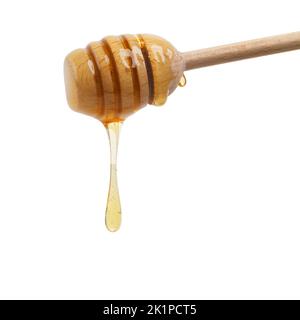 Food of the gods. Closeup shot of a honey spoon dripping delicious honey. Stock Photo