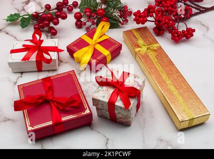 Christmas gift boxes isolated on marble table. Christmas decorations. Stock Photo