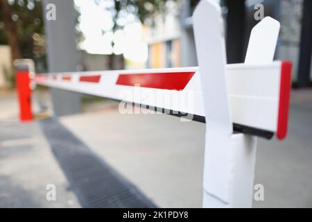 Closeup of closed barrier in car park in city Stock Photo