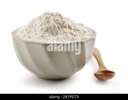 bowl of flour and wooden spoon isolated on white background Stock Photo