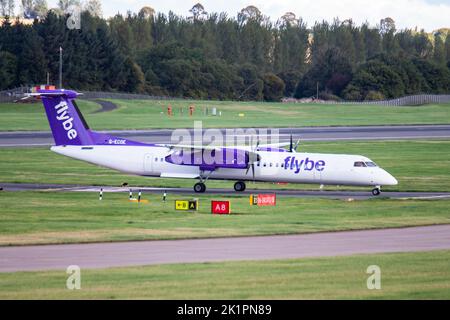 A beautiful shot of Flybe De Havilland Canada Dash airplane departing at Edinburgh airport Stock Photo