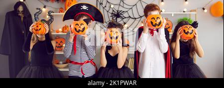 Web banner of children in costumes celebrate Halloween Stock Photo