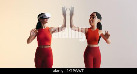 Woman experiencing a 3D simulation in the metaverse. Young woman playing virtual reality games as a 3D avatar. Young woman interacting with immersive Stock Photo