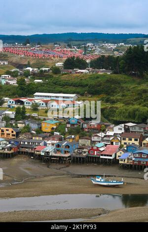 Chile, Chiloe island -traditional built palafitos along the Rio Gamboa in the capital Castro are built on stilts or poles. Stock Photo