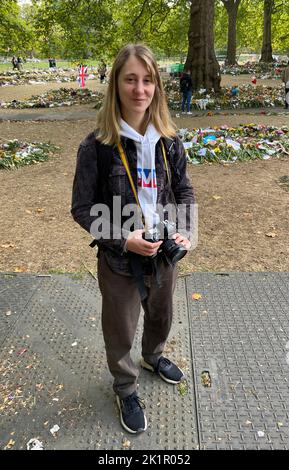 Oriol Julie, a 26-year-old photographer from Paris, France at the floral tribute area in Green Park, London. Picture date: Tuesday September 20, 2022. Stock Photo