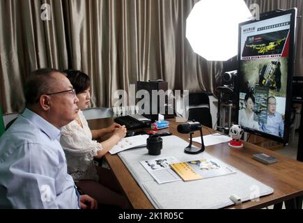 ZHANGJIAKOU, CHINA - SEPTEMBER 20, 2022 - Technicians of Huatai Mining, Metallurgy and Machinery Co LTD exchange technical issues with customers via a Stock Photo