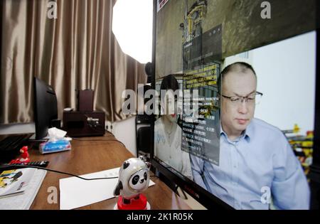 ZHANGJIAKOU, CHINA - SEPTEMBER 20, 2022 - Technicians of Huatai Mining, Metallurgy and Machinery Co LTD exchange technical issues with customers via a Stock Photo