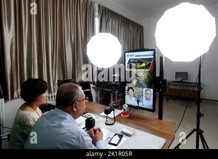 ZHANGJIAKOU, CHINA - SEPTEMBER 20, 2022 - Technicians of Huatai Mining, Metallurgy and Machinery Co LTD exchange technical issues with customers via a Stock Photo