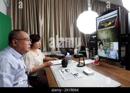 ZHANGJIAKOU, CHINA - SEPTEMBER 20, 2022 - Technicians of Huatai Mining, Metallurgy and Machinery Co LTD exchange technical issues with customers via a Stock Photo