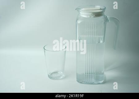 A carafe of clean water and a glass Stock Photo