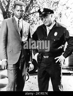 SIDNEY POITIER as Detective Virgil Tibbs and ROD STEIGER as Chief Bill Gillespie in IN THE HEAT OF THE NIGHT 1967 director NORMAN JEWISON novel John Ball screenplay Stirling Silliphant music Quincy Jones The Mirisch Corporation / United Artists Stock Photo