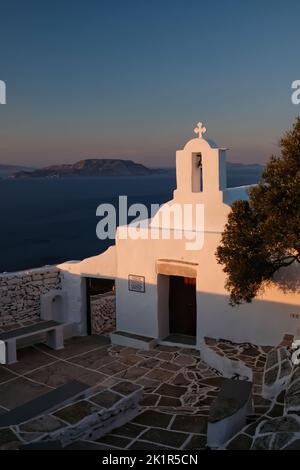 View of the beautiful and whitewashed Paleokastro Monastery and the Aegean Sea in the background Stock Photo