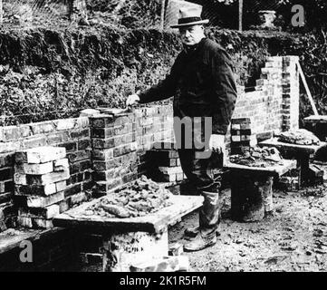 Winston Churchill bricklaying a wall at Chartwell 1928 Stock Photo