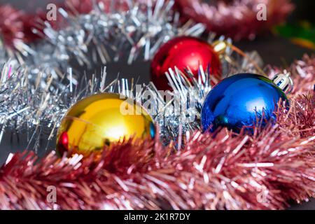 Festive decorations on the Christmas tree and New Year's tinsel Stock Photo