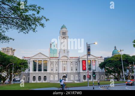 Victoria Theatre and Concert Hall surrounded by Empress Lawn on banks of Singapore River. Singapore Stock Photo