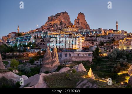 Uchisar castle, Twilight photo of the perforated castle rock of Uçhisar, Goreme, Cappadocia, Anatolia, Turkey Stock Photo