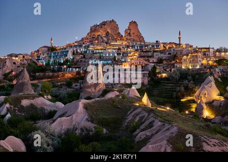 Uchisar castle, Twilight photo of the perforated castle rock of Uçhisar, Goreme, Cappadocia, Anatolia, Turkey Stock Photo