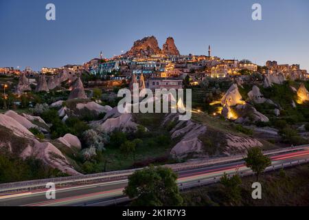 Uchisar castle, Twilight photo of the perforated castle rock of Uçhisar, Goreme, Cappadocia, Anatolia, Turkey Stock Photo