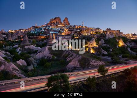 Uchisar castle, Twilight photo of the perforated castle rock of Uçhisar, Goreme, Cappadocia, Anatolia, Turkey Stock Photo