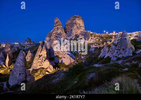 Uchisar castle, Twilight photo of the perforated castle rock of Uçhisar, Goreme, Cappadocia, Anatolia, Turkey Stock Photo