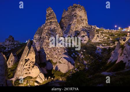 Uchisar castle, Twilight photo of the perforated castle rock of Uçhisar, Goreme, Cappadocia, Anatolia, Turkey Stock Photo