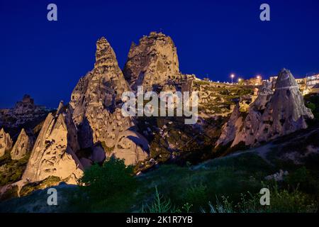 Uchisar castle, Twilight photo of the perforated castle rock of Uçhisar, Goreme, Cappadocia, Anatolia, Turkey Stock Photo