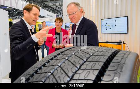 Hanover, Germany. 20th Sep, 2022. Nikolai Setzer (l-r), Executive Board member of Continental AG, shows Hildegard Müller, President of the German Association of the Automotive Industry (VDA), and Stephan Weil (SPD), Minister President of Lower Saxony, sustainable tire solutions for commercial vehicles at Continental's stand at the International Motor Show IAA Transportation for Commercial Vehicles at the Hanover Trade Fair Center. Credit: Julian Stratenschulte/dpa/Alamy Live News Stock Photo