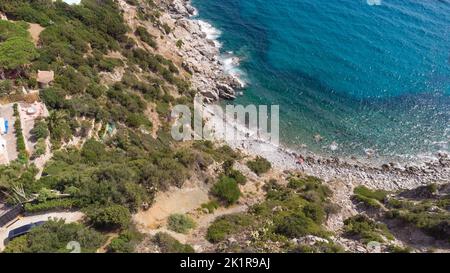 An amazing aerial view of the Sardinian coast. The wonderful colors of the sea contrast with the colors of the rocks. Stock Photo