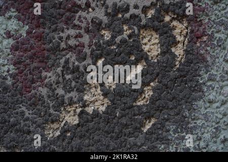 Cracked wall with old layers of paint, copy space Stock Photo