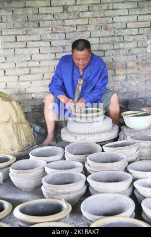 CHONGQING, CHINA - SEPTEMBER 19, 2022 - A view of clay pottery fired by a master in Chongqing, China, Sept 19, 2022. Sand pottery is made of local uni Stock Photo