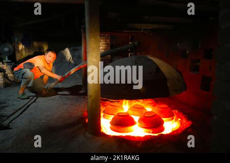 CHONGQING, CHINA - SEPTEMBER 19, 2022 - A view of clay pottery fired by a master in Chongqing, China, Sept 19, 2022. Sand pottery is made of local uni Stock Photo