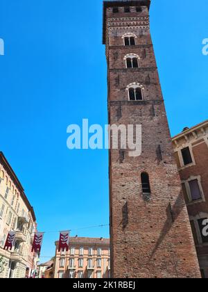 The Troyana Tower or Clock Tower is one of the architectural symbols of the city of Asti in Piazza Medici next to the Palazzo Ducale. Stock Photo