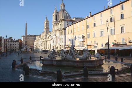 Piazza Navona is a symbol of Baroque Rome, with Bernini's Fontana dei Quattro Fiumi and Borromini's church of Sant'Agnese in Agone. Stock Photo