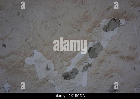 close-up of peeled cream-colored wall, dirty and worn, background, copy space Stock Photo