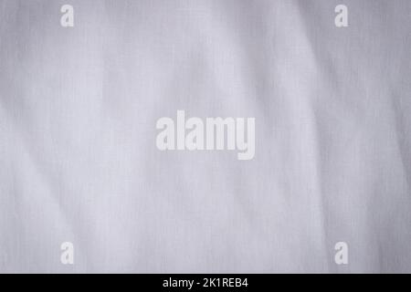 White crumpled linen fabric texture background. Natural linen organic eco textiles canvas background. Top view Stock Photo