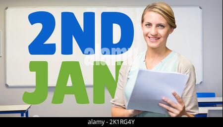 Composite of 2nd jan text with caucasian female teacher holding documents in classroom, copy space Stock Photo