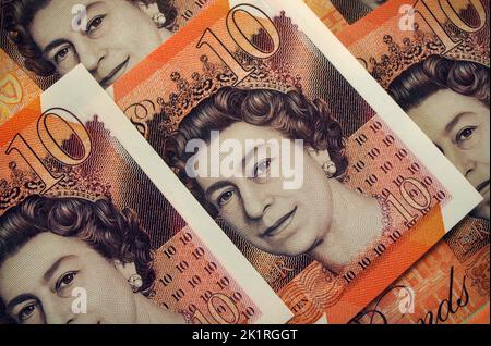 Close-up of Queen Elizabeth II face portrait on Ten Pound Bank of England banknotes. Plastic polymer currency introduced 2017. Stock Photo