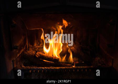 Closeup of fire burning in an old fireplace, can be used to composite in an existing image with unused fireplace Stock Photo