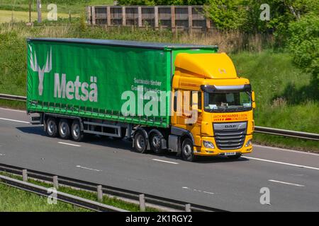 METSA WOODS Raw material from sustainably managed Nordic forests. Jack Richards & Son Ltd National road transport solutions ; Yellow HGV DAF XF travelling on the M6 motorway UK Stock Photo