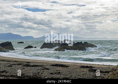 Looking aross from Llanddwyn Island towards the Llyn or Lleyn Peninsula in North Wales Stock Photo