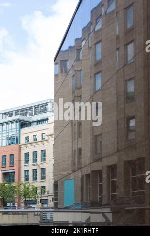 Office buildings in Conference Square reflected on exterior walls of modern building opposite, Edinburgh, Scotland Stock Photo