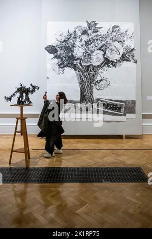 London, UK. 20th Sep, 2022. Cat Coffee Pot, 2019 with the Execution of Maximillian, 2017 - William Kentridge, South Africa's most celebrated living artist, a new exhibition at the Royal Academy of Arts. Transforming the Main Galleries with the biggest exhibition of the artist's work in the UK. Many pieces have never been seen before, and some have been made specifically for the show. Spanning a 40-year career with 4-metre wide tapestries, his signature charcoal trees and flowers, and large screen film. The show runs from 24 Sep- 11 Dec 2022. Credit: Guy Bell/Alamy Live News Stock Photo