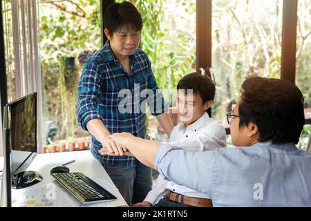 Programmers team joined hands in a software developing. Developing programming and coding technologies. Website design. Cyber space concept. Stock Photo