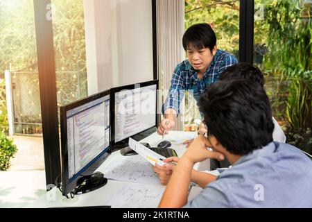 Programmers team working in a software developing. Developing programming and coding technologies. Website design. Cyber space concept. Stock Photo