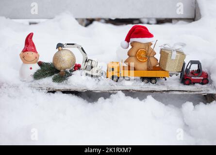model of toy metal excavator and a gingerbread in form of Christmas ...