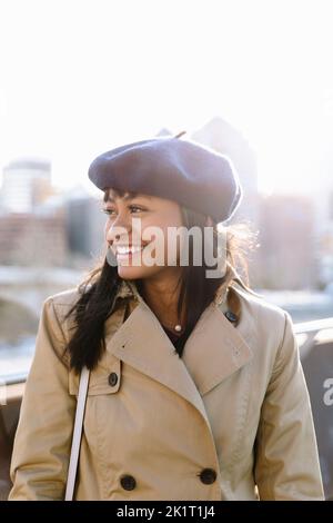 young woman in trench coat hugging stylish boyfriend in park, banner ...
