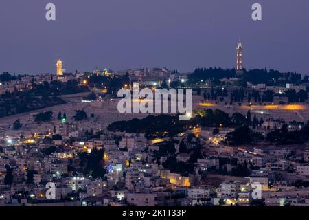 View at twilight of mount of Olives across the Palestinian neighborhoods of Ras al-Amud and Silwan in East Jerusalem, Israel Stock Photo